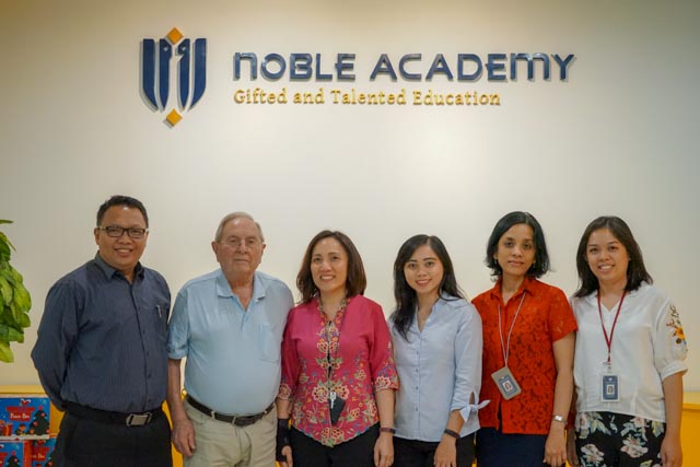 meet prof frank monks with noble academy team and students