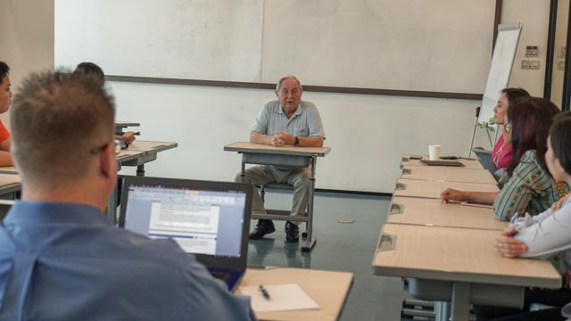 meet prof frank monks with noble academy team and students